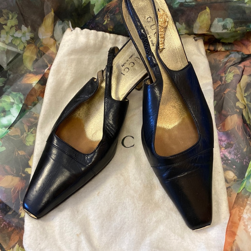 Gucci Black Mules with Brass accents on strap and toe. Size 8B
